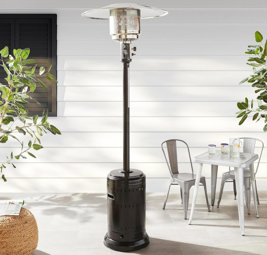 brown patio heater on a patio near a table