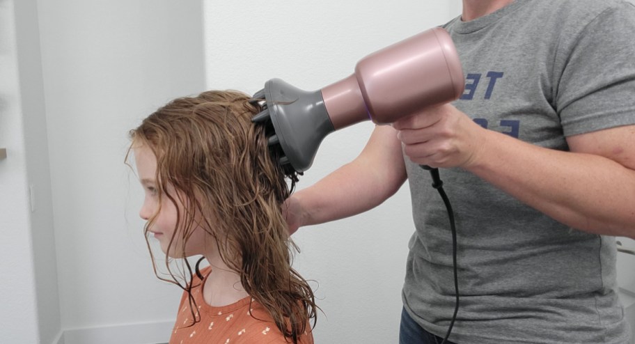 mom drying girls hair