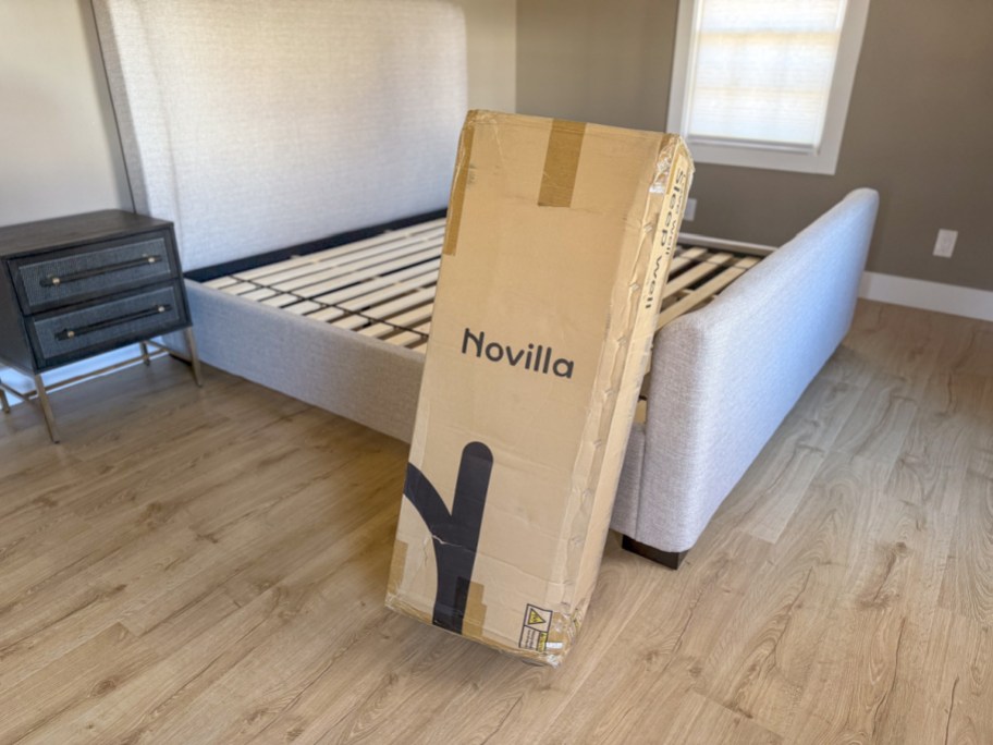 A novilla mattress next to the box