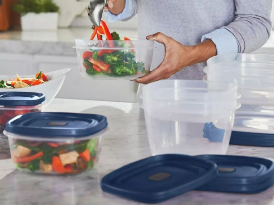 woman using Rubbermaid Easy Find Lids Food Storage Container 26-Piece Set w/ Vented Lids