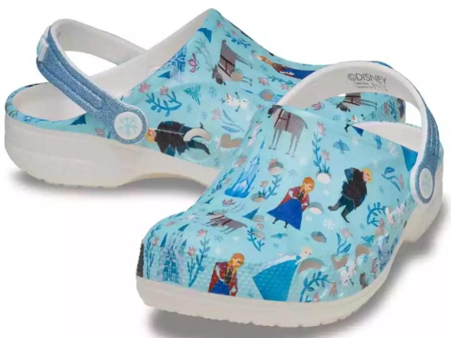 a pair of kids Disney Frozen Crocs clogs in blue and white with the movies' characters on them