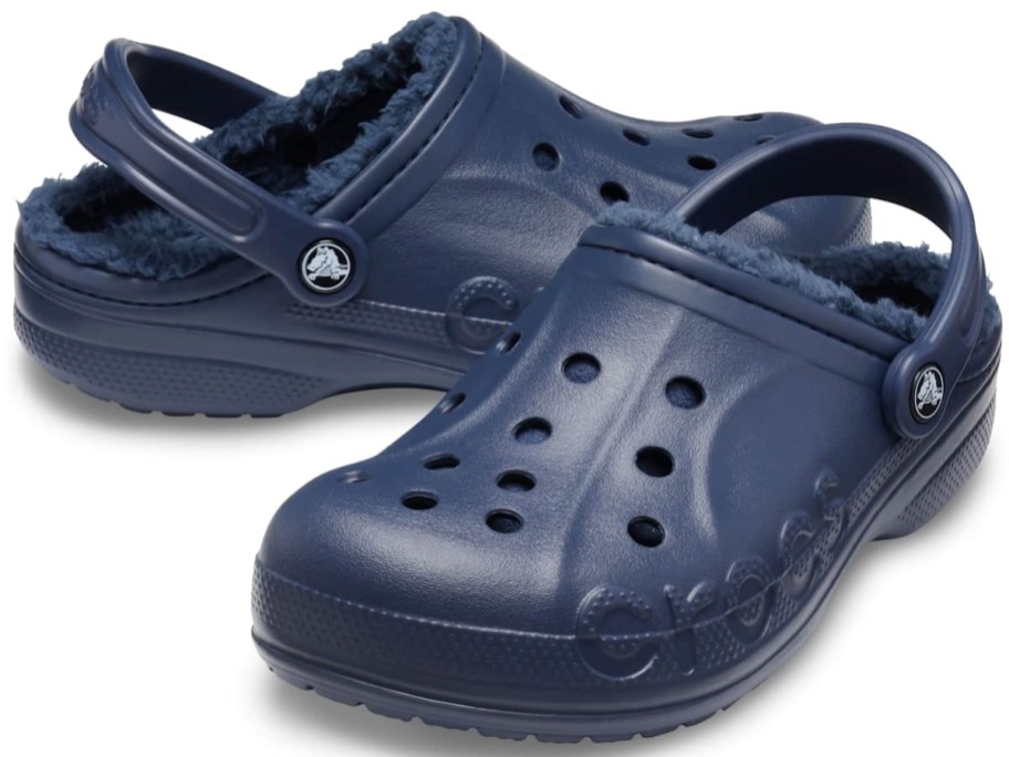 a pair of navy blue lined Crocs clog shoes