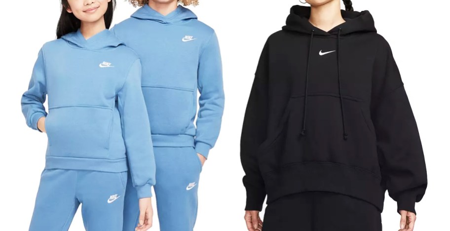 two kids in matching light blue hoodies and woman in black hoodie