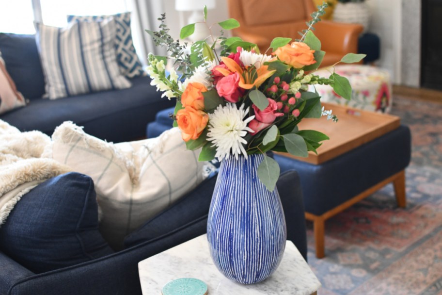 a floral arrangement on a side table