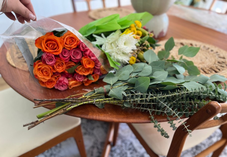 Various grocery store flowers on a table