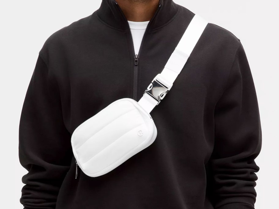 man wearing a white lululemon wunderpuff belt bag