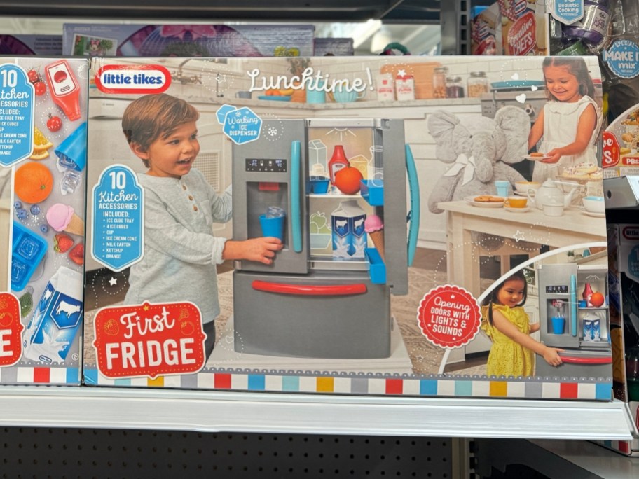 box with a Little Tikes First Fridge Refrigerator set in it on a shelf at Walmart