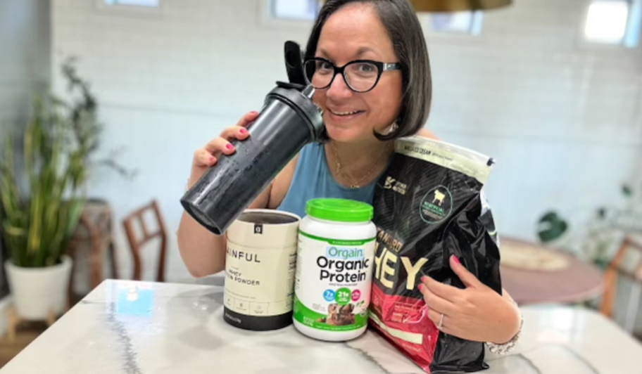 woman holding protein powders