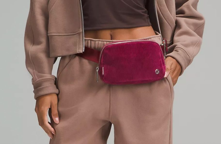 maroon corduroy belt bag around waist