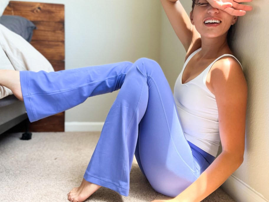 woman sitting on floor wearing purple flare pants and <a href='https://billioncandle.com/shop/white-candle-wick-stickers' target='_blank' rel='follow'>white</a> tank top” width=”912″ height=”684″></p>
<p>While supplies last, HURRY over to <a href=