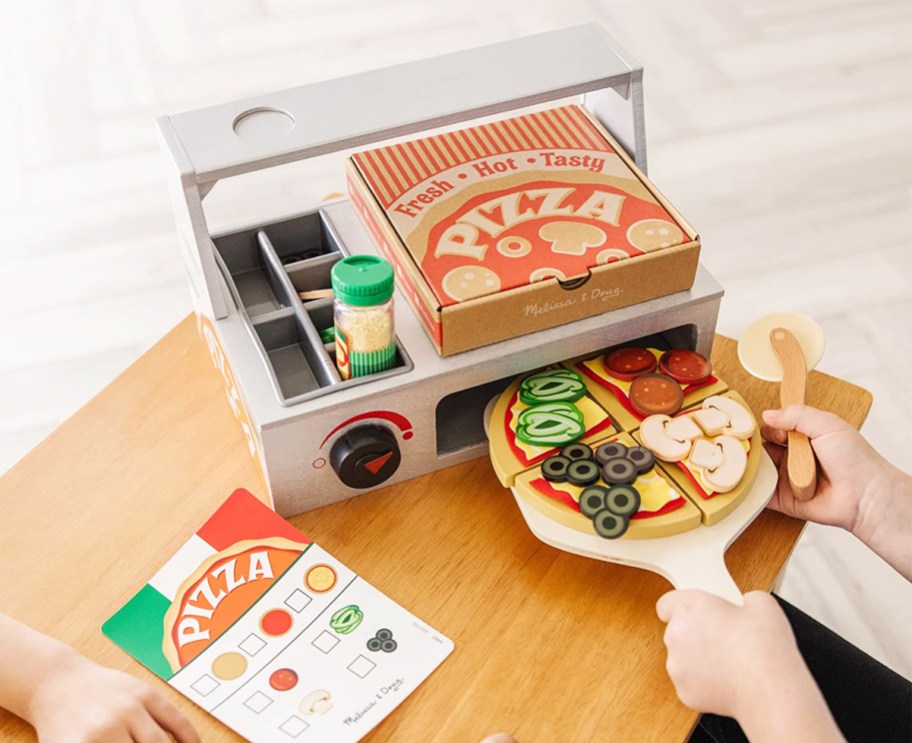 kids playing with pizza oven toy