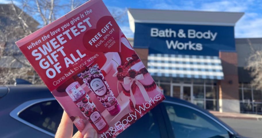 A person holding a Bath & Body Works Mailer 