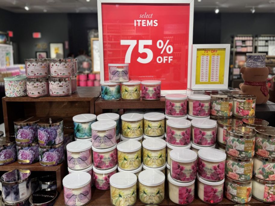 Bath & Body Works 3-wick Candles with signs for 75% off