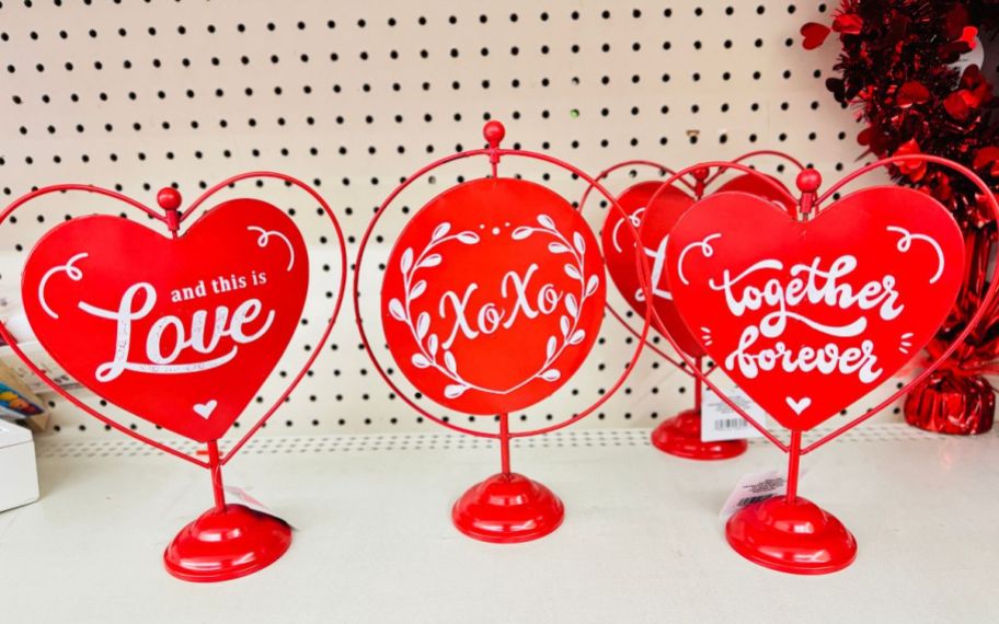 red metal table top decor signs on a store shelf