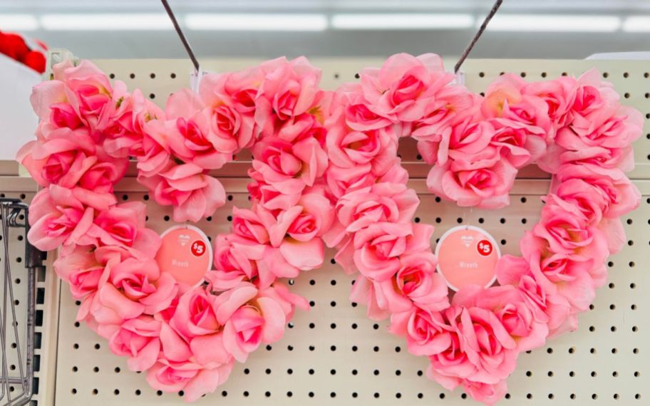 two heart shaped wreaths made of pink artificial roses