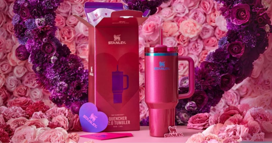 stanley valentines day tumbler next to box with flowers in the background