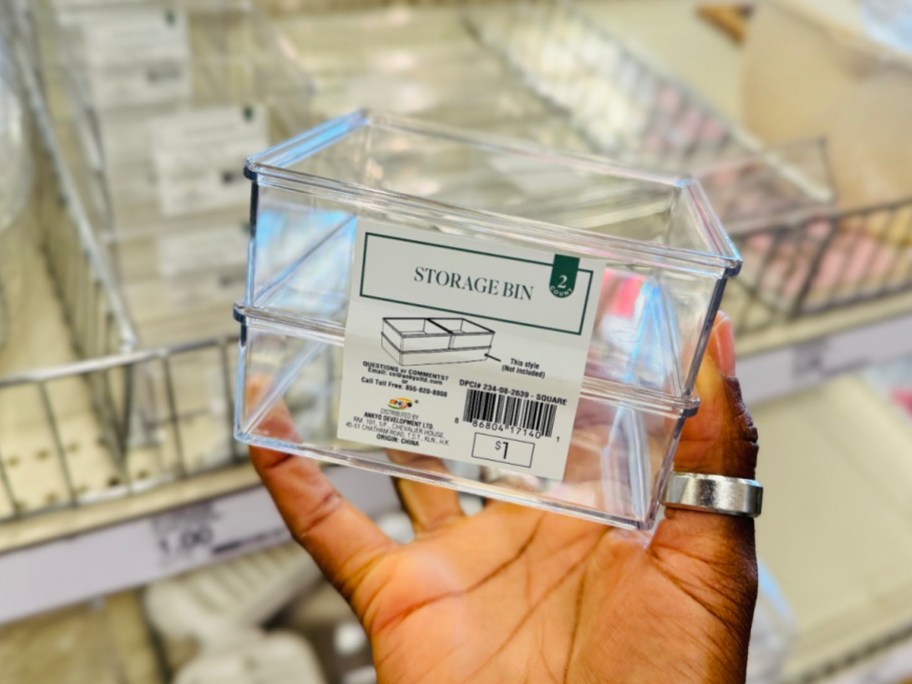 Small storage bins displayed in womans hand