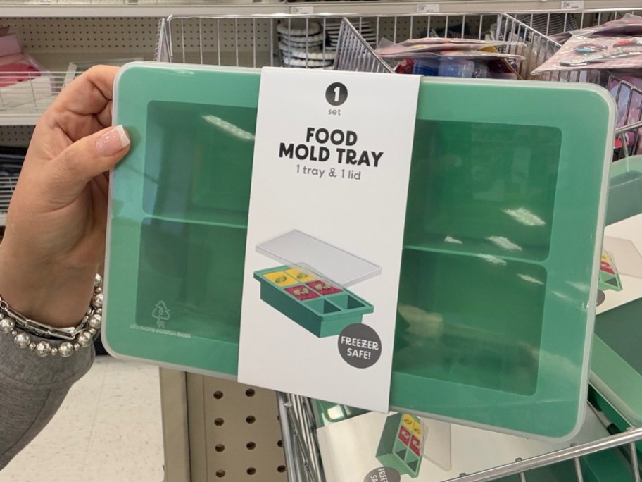 hand holding food mold tray