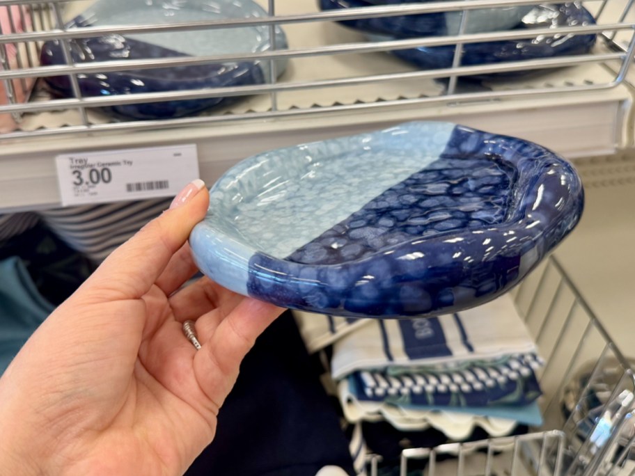 hand holding ceramic tray