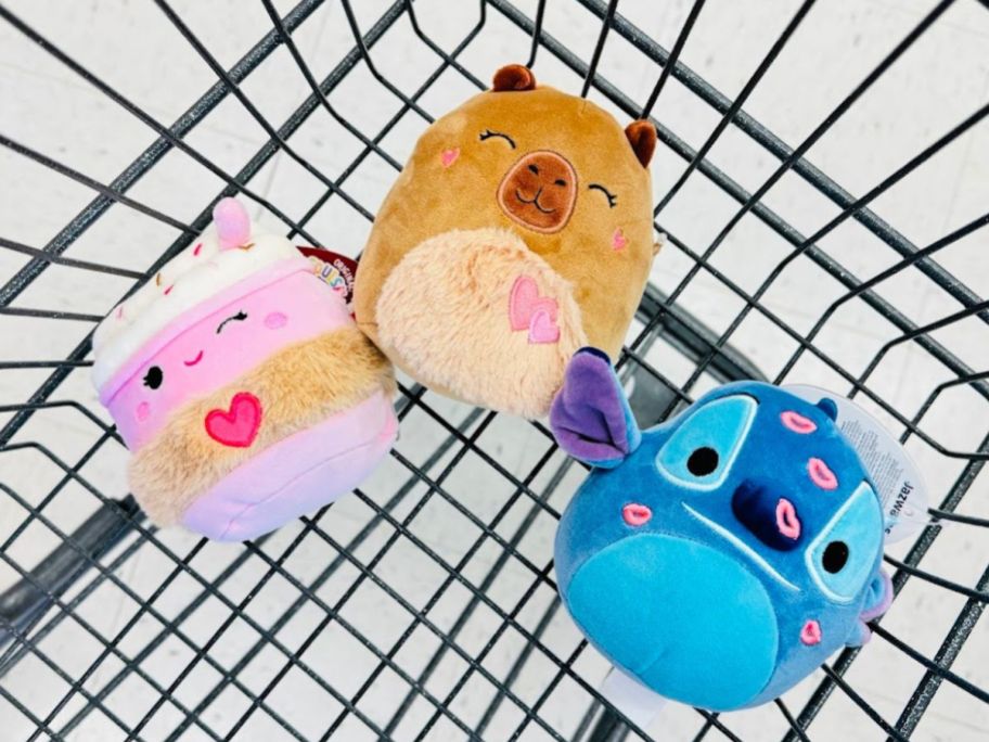 Squishmallow plush toys in a cart