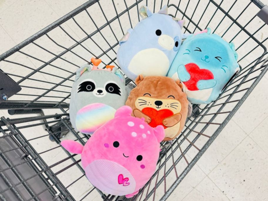 Squishmallow plush toys in a cart