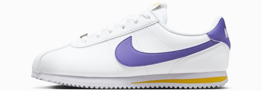 white, purple, and yellow nike sneaker