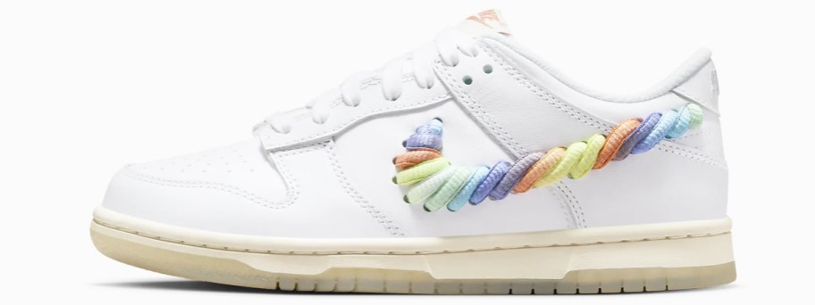 white nike with multicolored checkmark on side