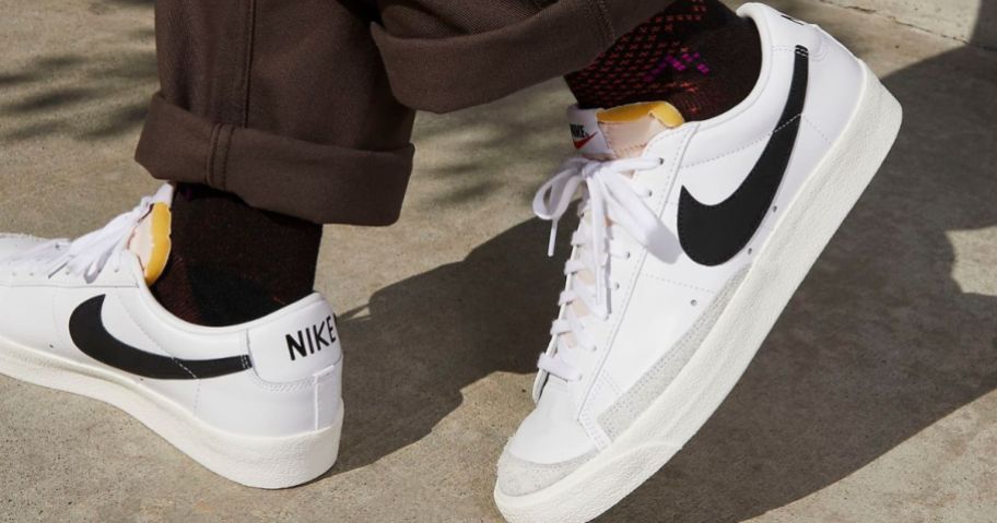 feet wearing Nike Blazer Low '77 Vintage Men's Shoes in white