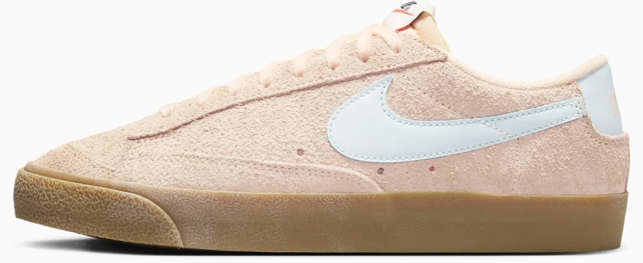 light pink low cut sneaker with white nike logo