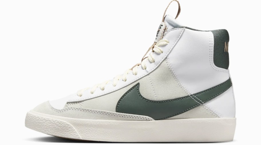 white high top sneaker with green nike logo