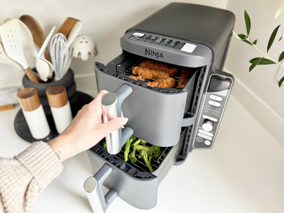 hand opening baskets on Ninja DoubleStack Air Fryer