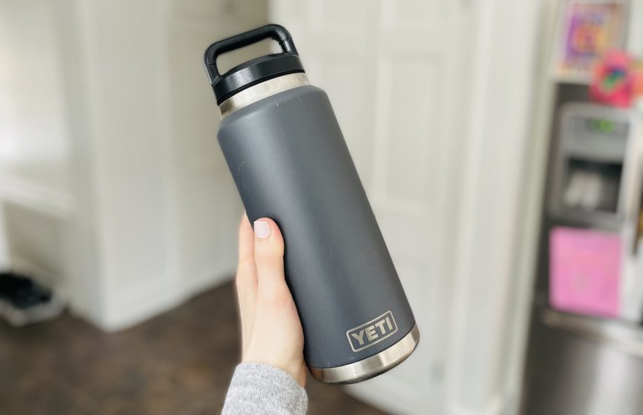 hand holding large yeti water bottle