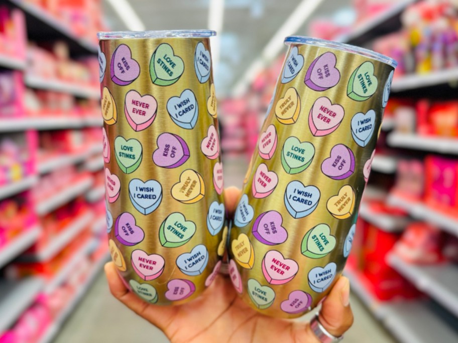 hand holding Valentine's Day candy heart tumbler