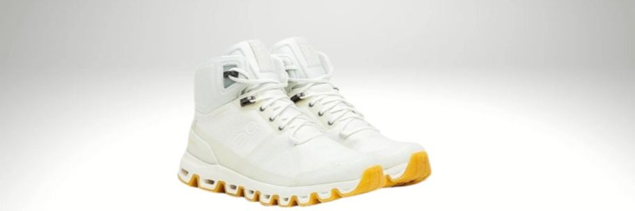 pair of white and yellow on cloud shoes