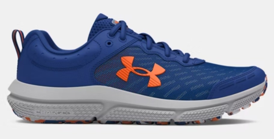 a boy's Under Armour running shoe in blue with orange and grey accents