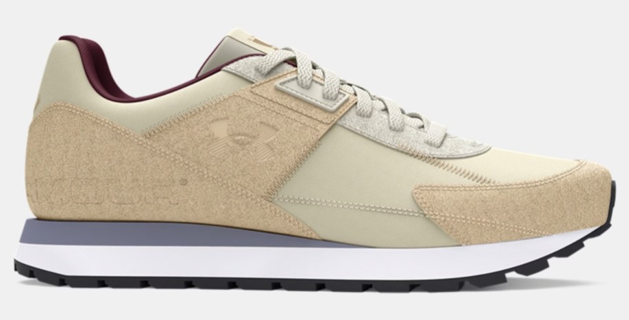 a men's Under Armour running shoe in tan with with different tones of tan and grey