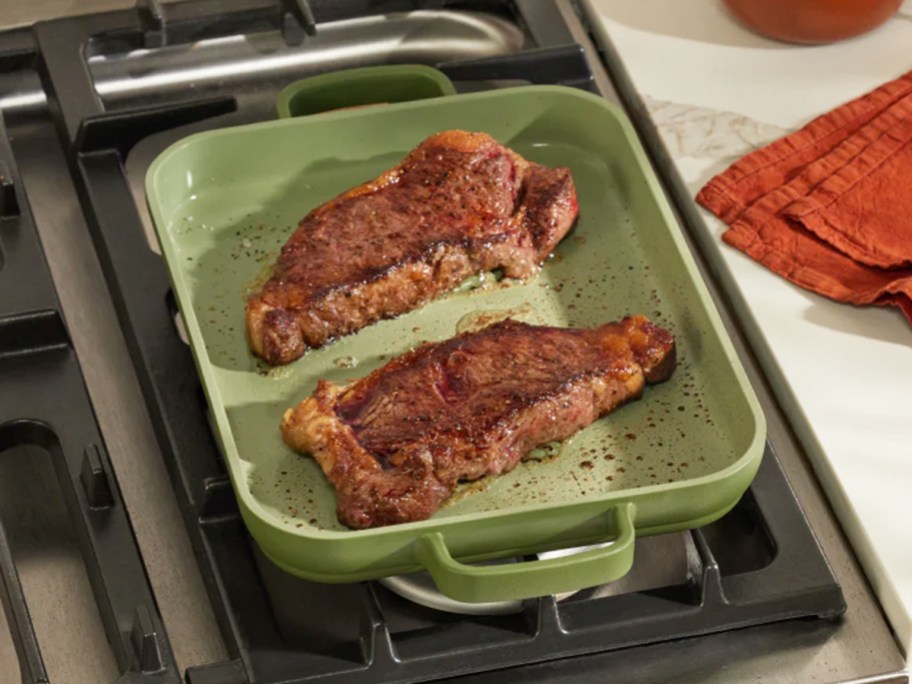 cooking steaks in a griddle pan