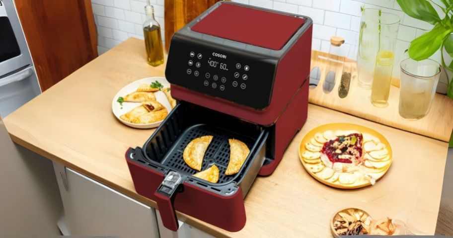 Cosori Pro II 5.8-Quart Smart Air Fryer in Red open on counter