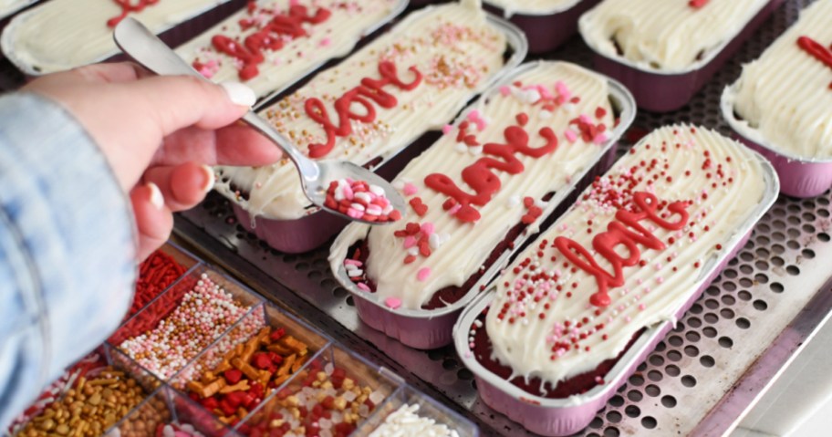 adding sprinkles to vday cake