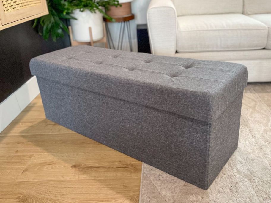 An Ornqavo Tufted Linen Storage Ottoman