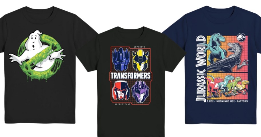 3 boy's graphic tshirts in black, one has the Ghostbusters logo, one has Transformers, and one has Jurassic World images