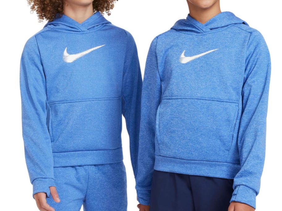 two kids wearing Nike Multi+ Big Kids Therma-FIT Pullover Hoodies