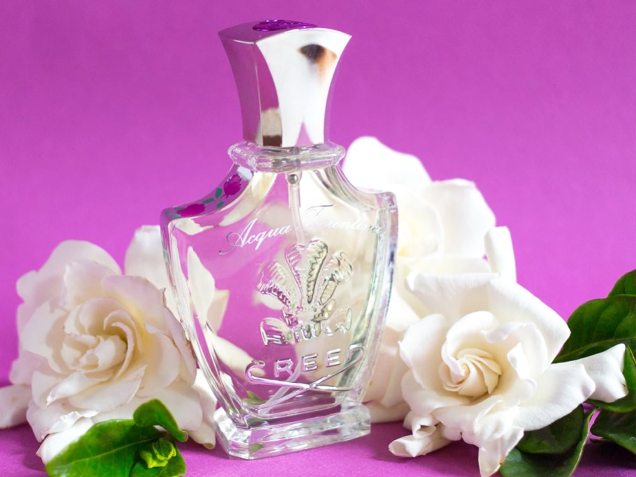 bottle of Creed Acqua Fiorentina with white roses