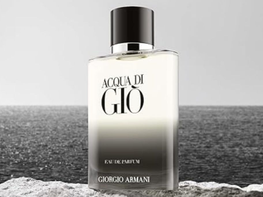 Armani Beauty Acqua di Giò Eau de Parfum Cologne on rock in front of ocean