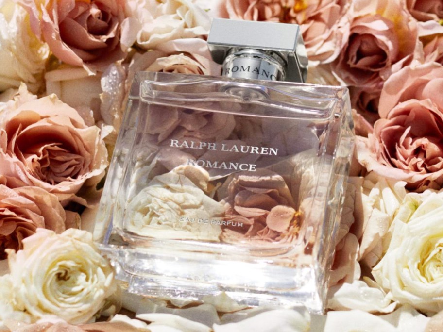 bottle of Ralph Lauren Romance laying in roses