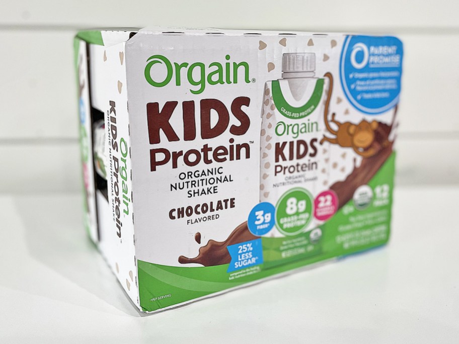 Orgain Organic Kids Chocolate Nutritional Protein Shake 12-Pack case on kitchen counter