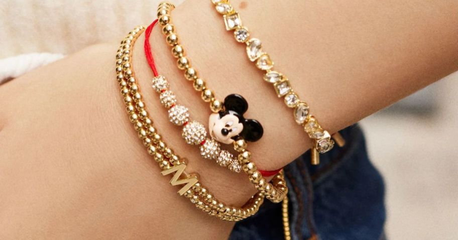 girl wearing baublebar jewelry on her wrist