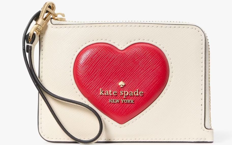 a small wristlet with a red puffy heart and wrist strap