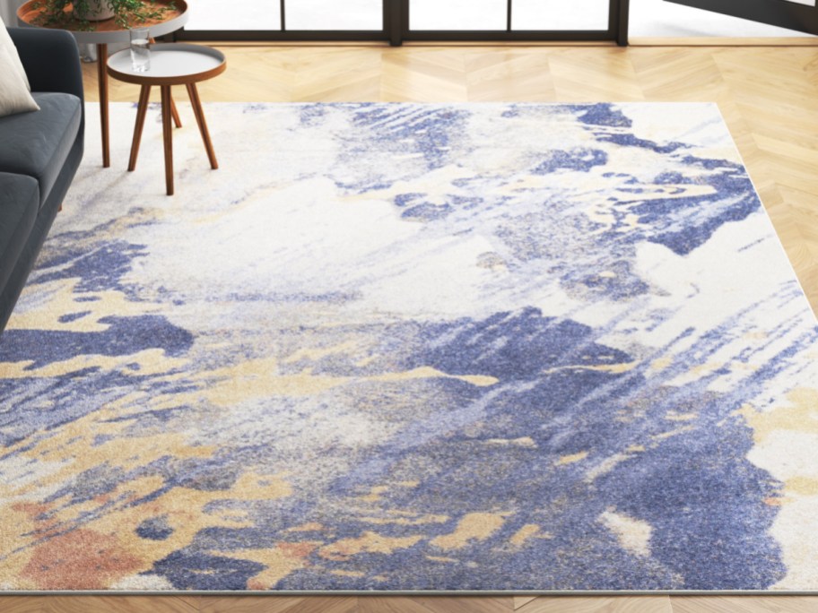 blue, cream, bold, and orange, abstract Area Rug on the floor