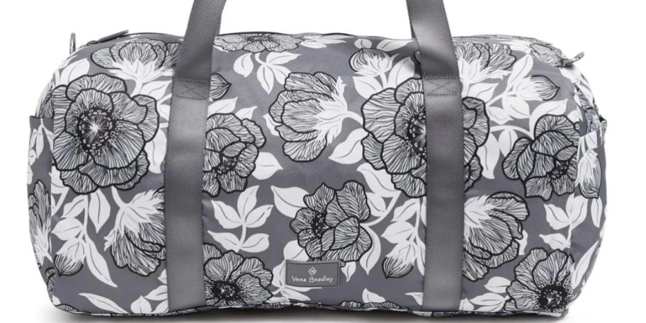 a large black and grey floral duffle bag